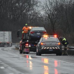 emergency-road-and-towing-services-on-interstate-on-wet-day-in-winter-disabled-vehicle-car-accident.jpg